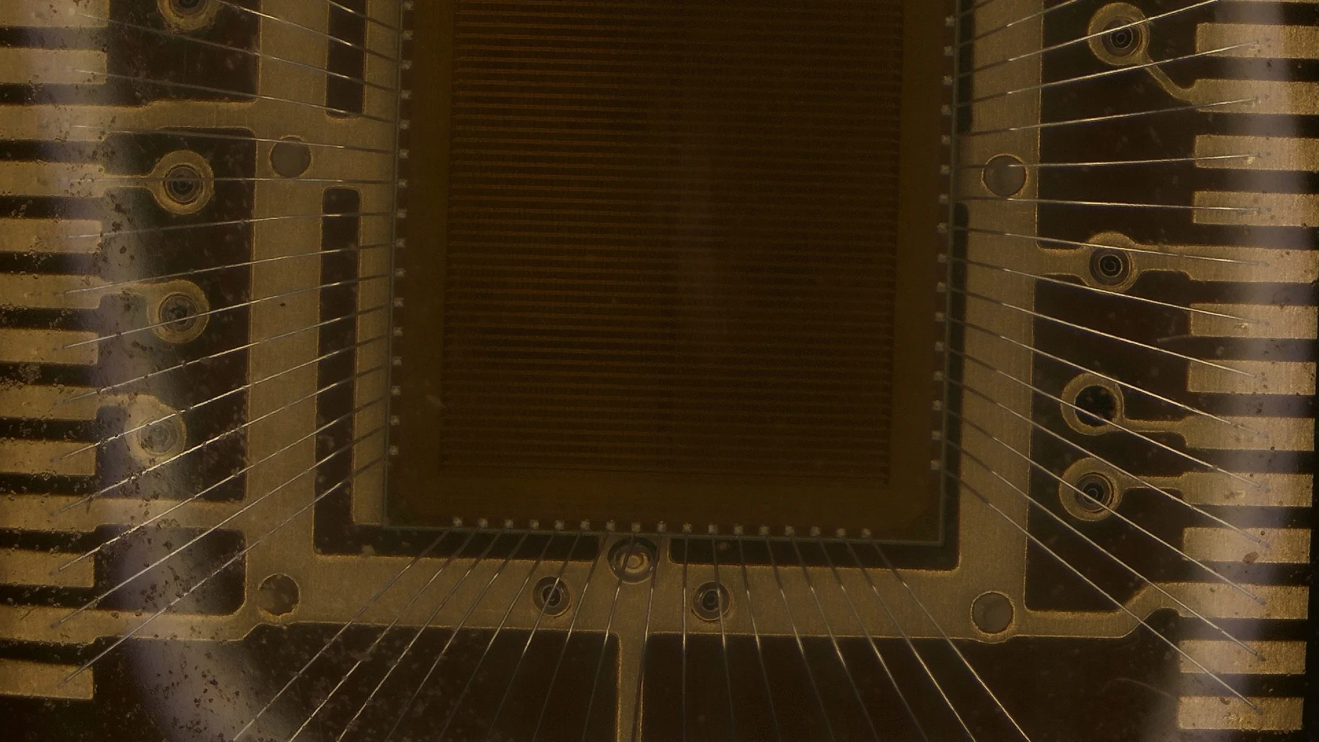 High-magnification view of an IC die surface and bonding region